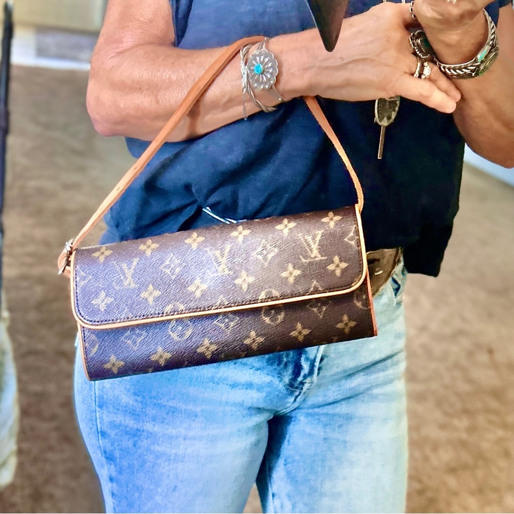 Authentic Louis Vuitton, envelope style 10”x4-1/2“ bag.